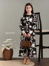 Junior girl wearing YEZWE full-length modest dresses for girls with floral black and white maxi dress